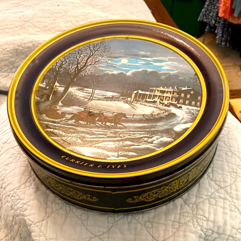 Vintage large currier and Ives art fruitcake tin.